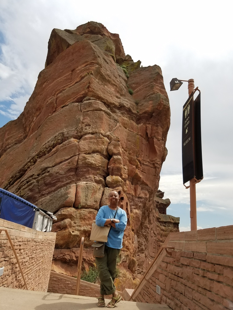 Juanita A. Gardner, MPH, BS, PA-C, an Assistant Clinical Professor in the Physician Assistant Program in the College of Nursing and Health Professions, standing in front of tall rocks.